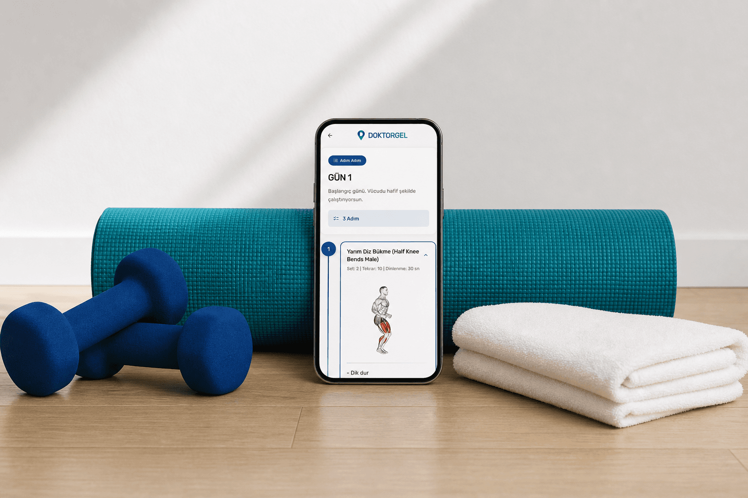 Egzersiz günü ekranı, rulo yoga matına yaslı telefonda